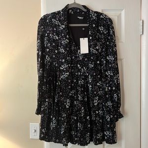 Floral dress with tags on. Size 6.